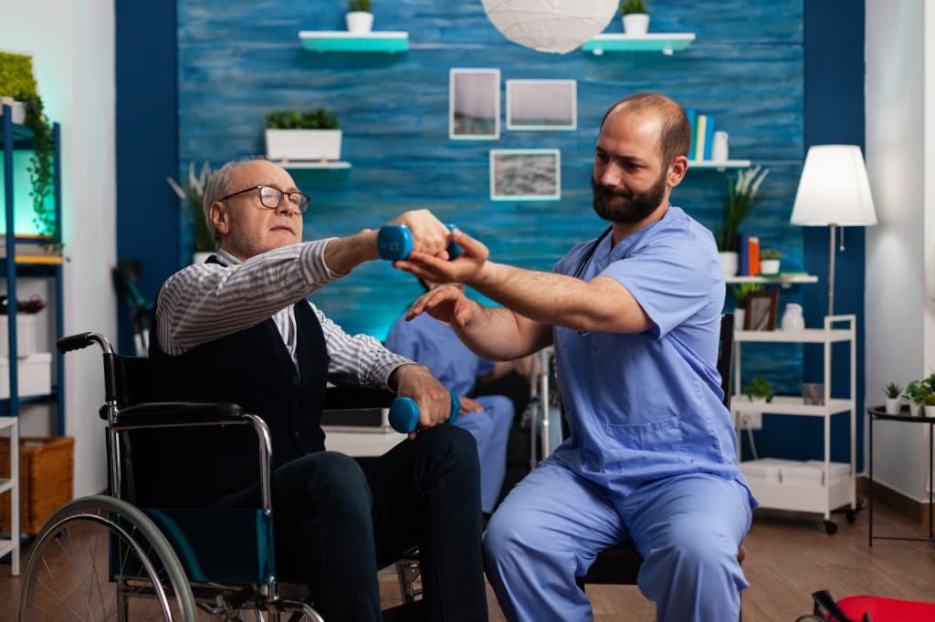 Physiotherapist guiding a patient through rehabilitation at Body Experts